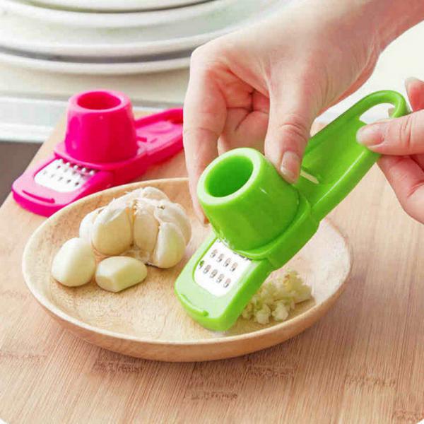 Garlic Press Rocker Garlic Crusher Tool Roller Slicer for Ginger Nuts Bottle Opener